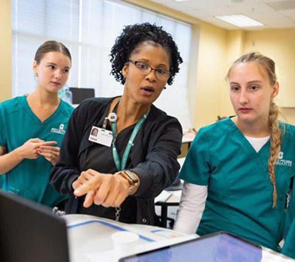 Head nurse teaching student nurses