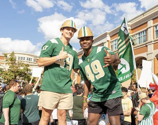 Two students giving thumbs up