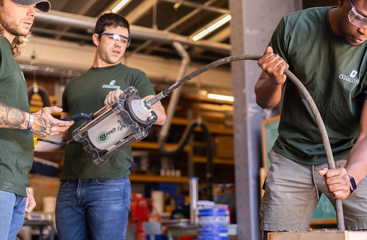 Students working with construction equipment