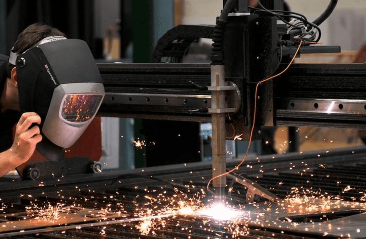 Student using a welding machine